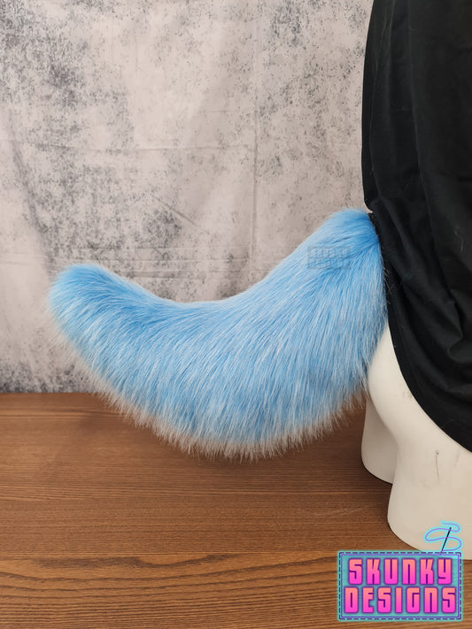 Large nub tail - light blue fur with whispy white tips