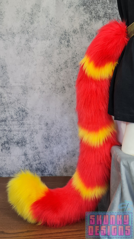 Feline tail - red with yellow v-wave pattern